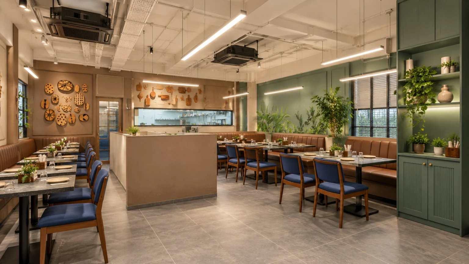 Keshavam Thal interior reference with eucalyptus green walls, taupe sofas and blue wooden chairs